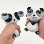 two squeeze panda toys in hand