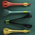 4 different colours of Pasta spoon with egg beater